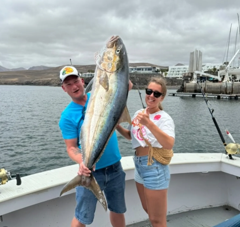 Shared fishing trip in Lanzarote with anglers enjoying a fishing charter and tuna catch